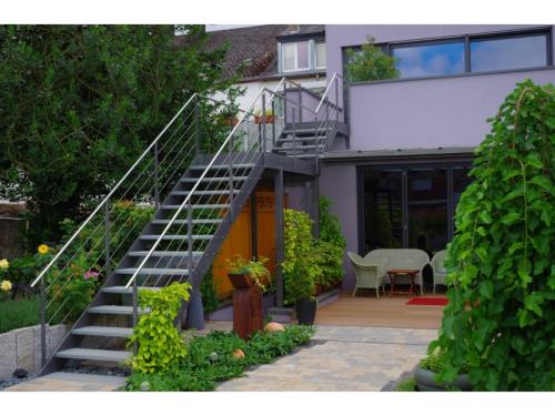 Steel staircase with stainless steel railing